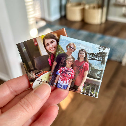 Two custom square photo magnets with smiling kids on them.