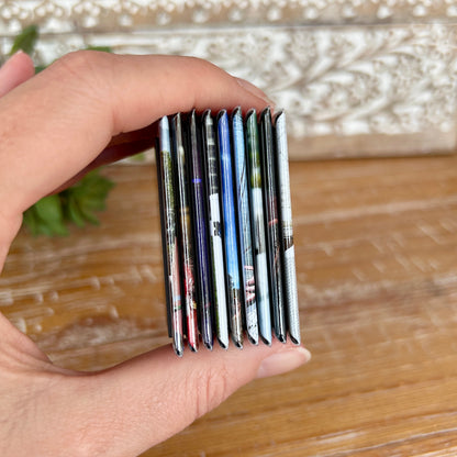 Side view of 9 two by two inch photo magnets